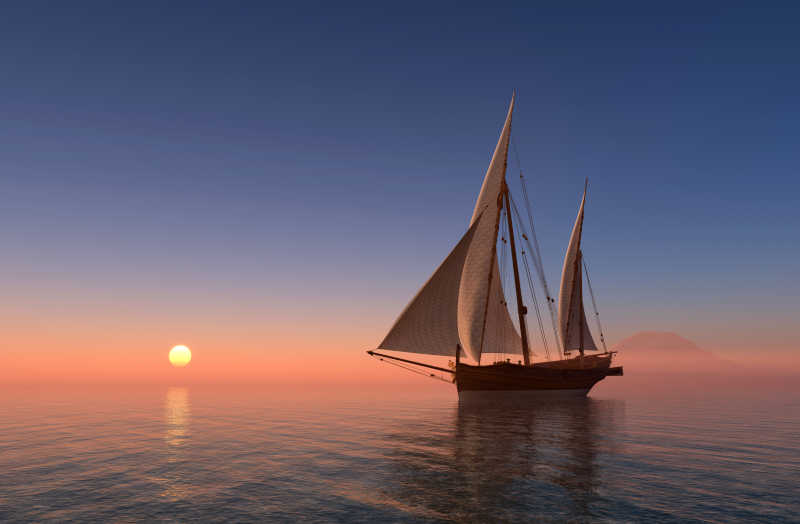 夕阳下浩浩荡荡前行的帆船