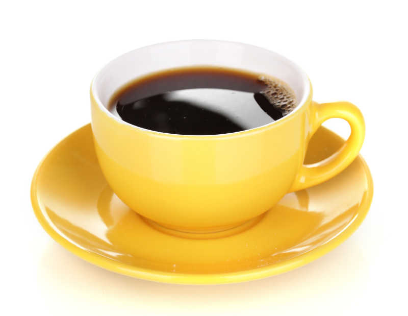 白色背景下的的黄色茶杯和茶托