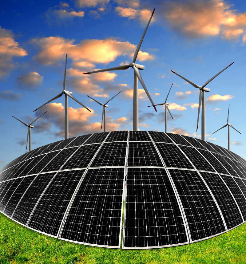 日落下的太阳能电池板和风力涡轮机