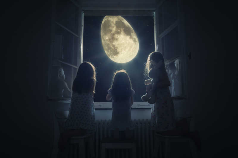 三个小女孩看着复活节彩蛋形的月亮