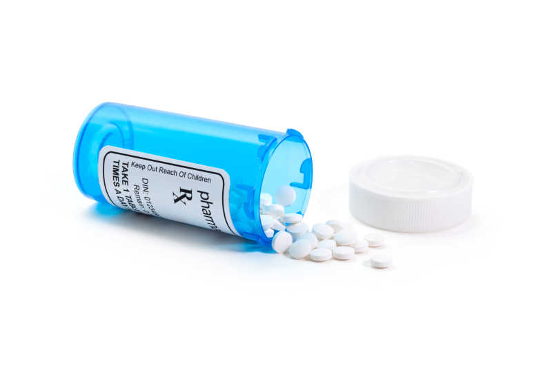 蓝色药瓶里的白色处方药品