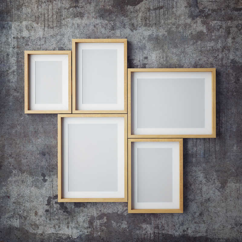 深灰色墙面上的空白海报框架