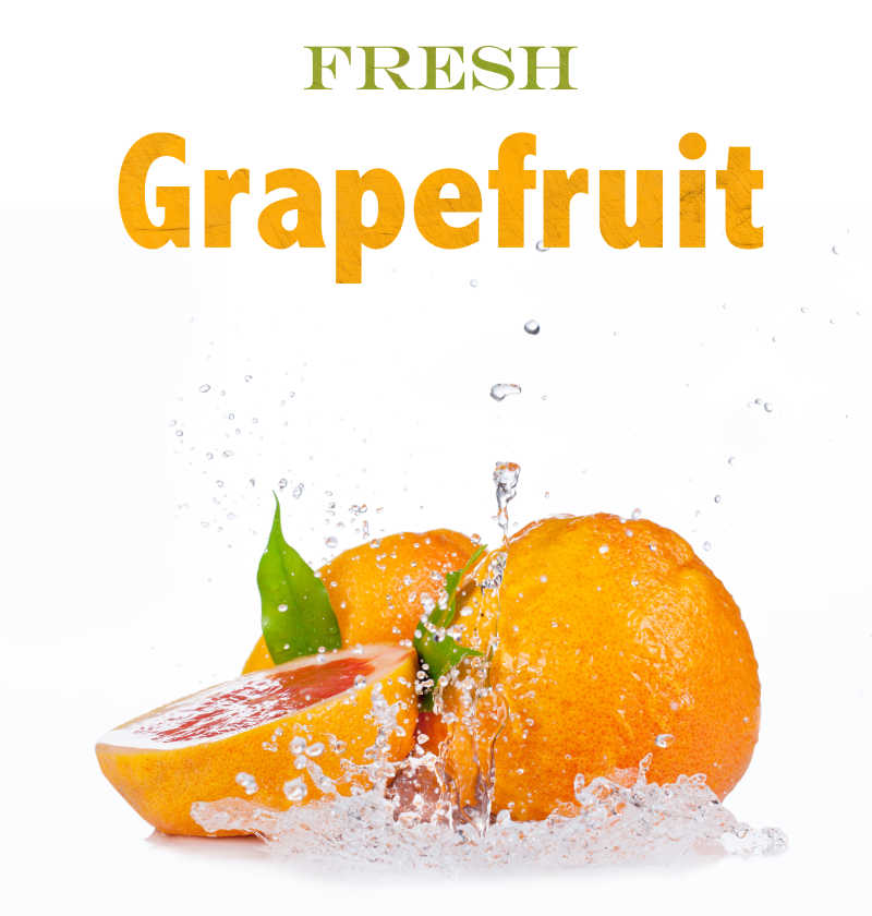 白色背景上的葡萄柚和飞溅的水滴特写