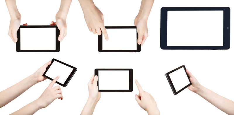 白色背景下玩平板电脑的手