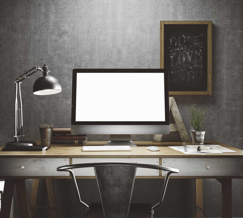 灰色调办公桌上的电脑