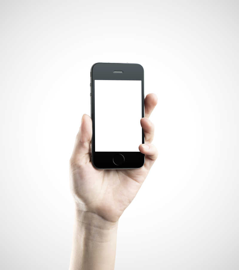白色背景下手持黑色的智能手机