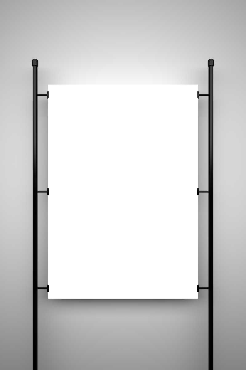 灰色背景下挂在黑色架子上的空白海报