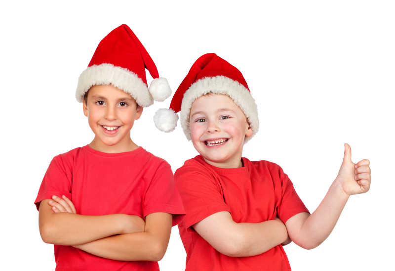 两个戴着圣诞帽的孩子