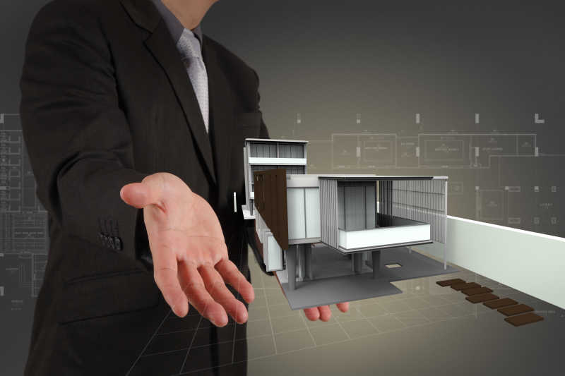 一个商人和他的商业建筑模型