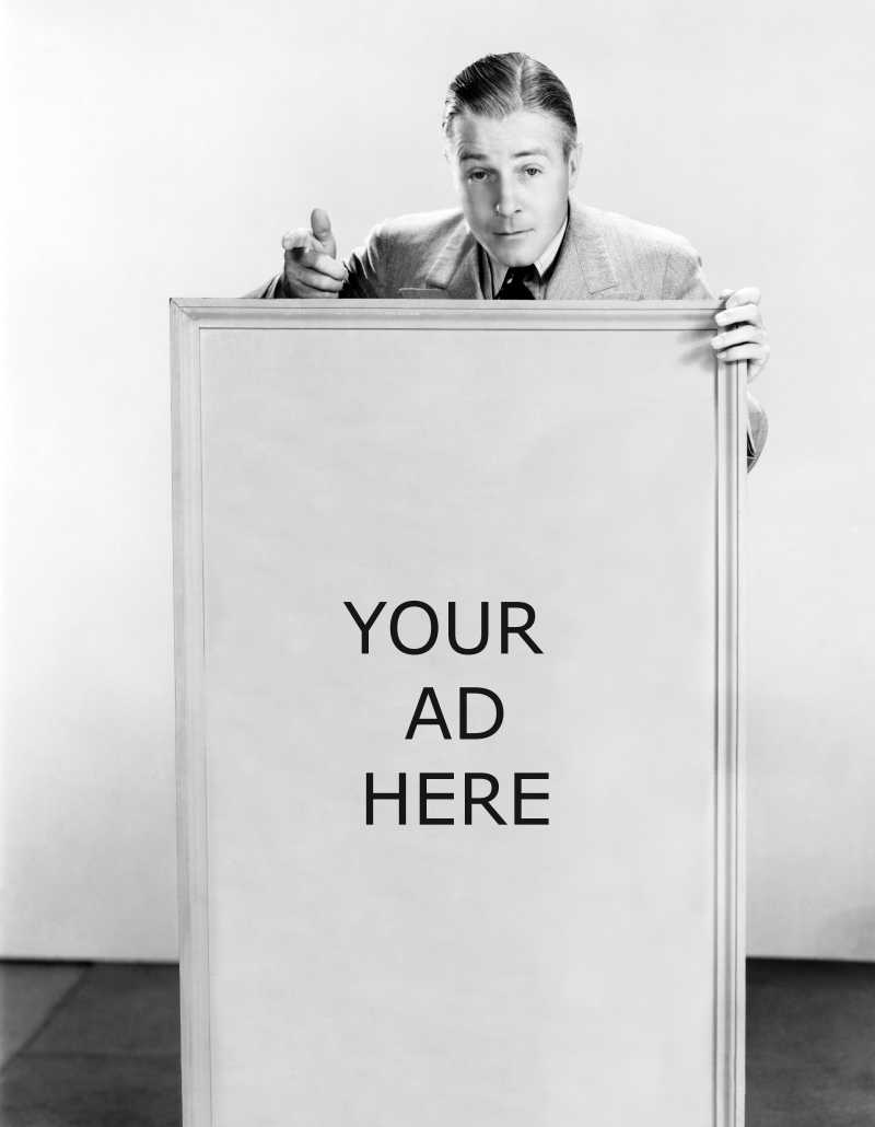 一个复古的男人拿着黑白色的广告框