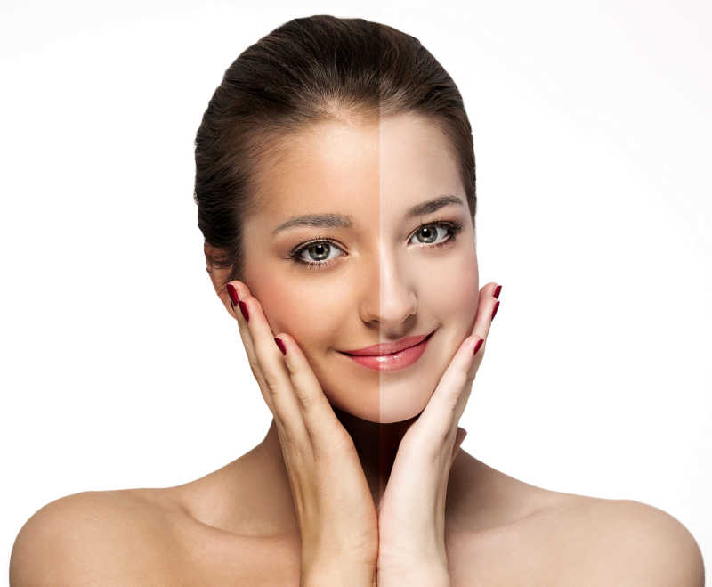 白色背景下晒黑半边脸的美女肖像