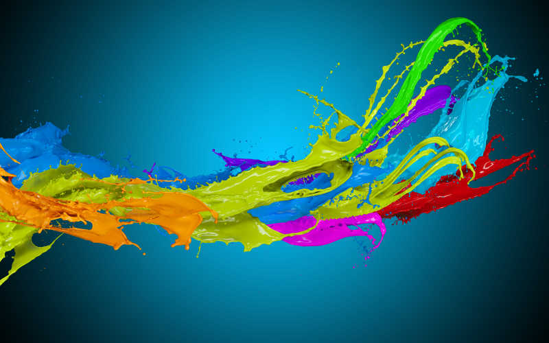 蓝色背景下飞溅的彩色液体