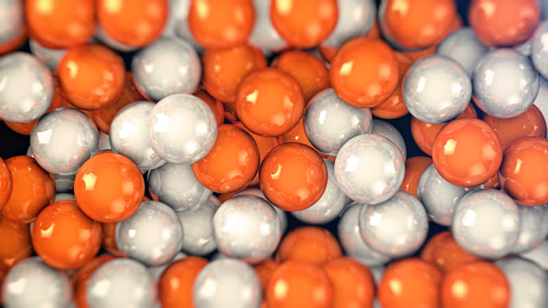 密集橙色和白色的颜色球背景