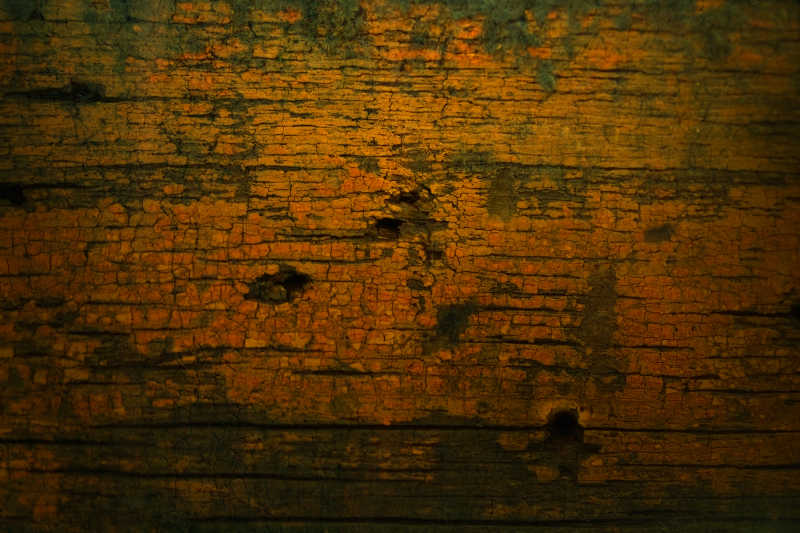 黄绿色红色渐变木制纹理背景