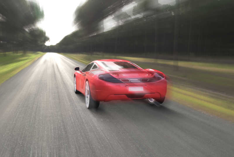 公路上开的很快的红色跑车