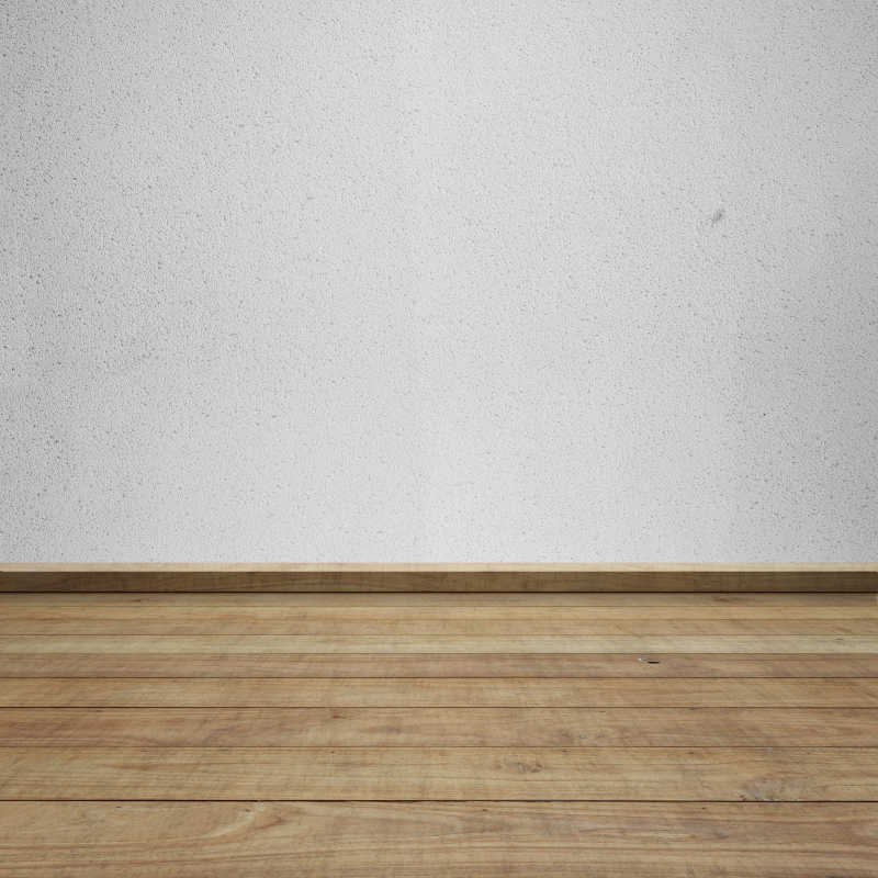 木地板和灰色的混泥土墙相连接背景