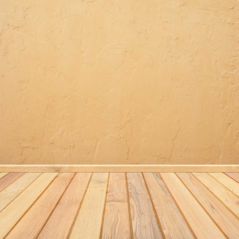 黄色的混凝土墙和木地板