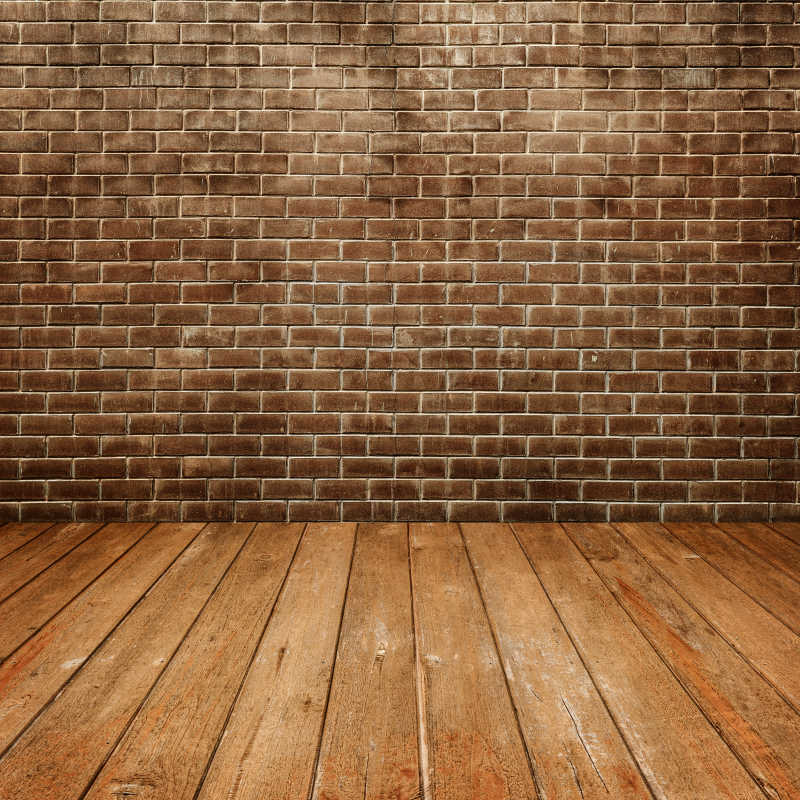 混泥土砖墙和木地板连接背景