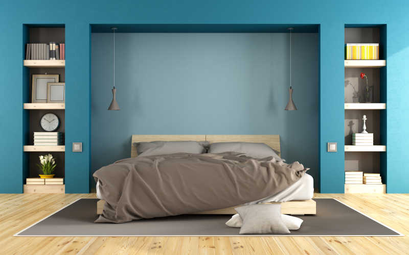 蓝色现代卧室与木床和壁龛与书籍