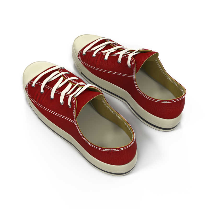白色背景下的红色帆布鞋
