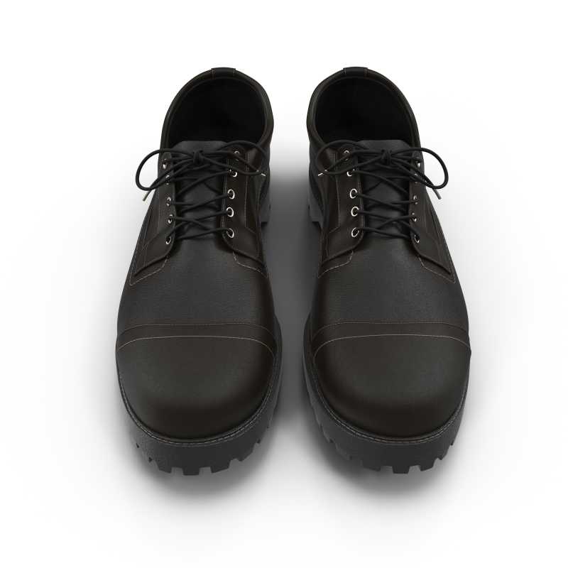 白色背景上的黑色绑带皮鞋