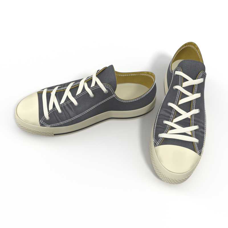 白色背景上绑带的蓝色帆布鞋