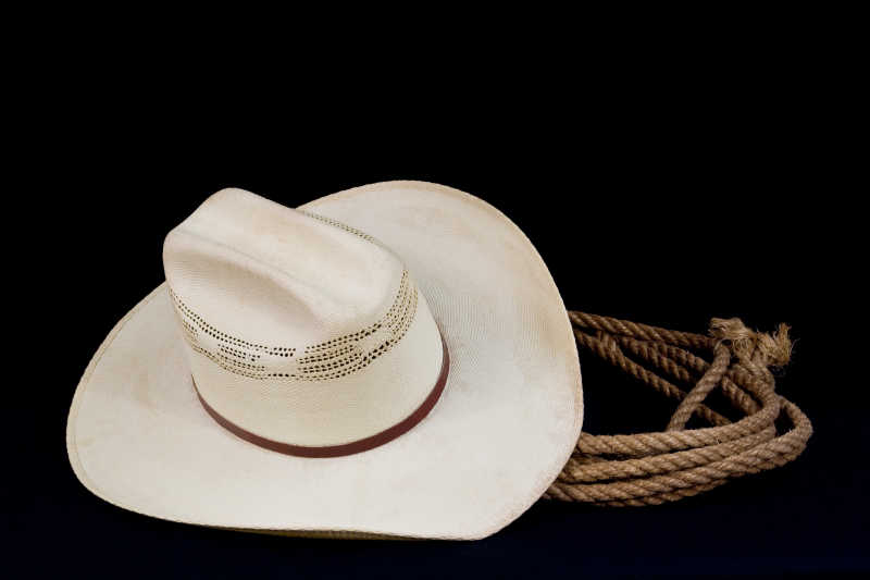 西部牛仔的白色牛仔帽和套绳