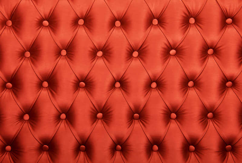 红色豪华纽扣装饰皮革背景