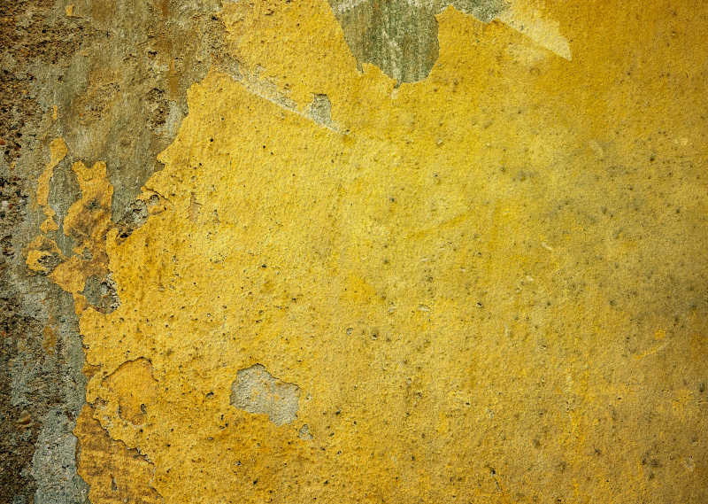 黄色破旧有墙体脱落的墙面纹理背景
