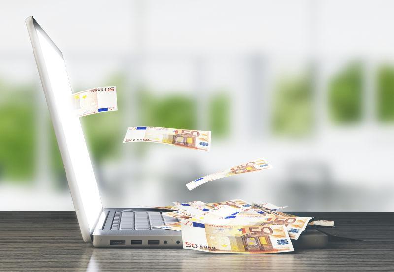 笔记本电脑飞出欧元概念
