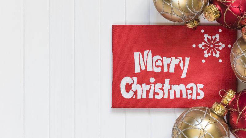 红色装饰的圣诞快乐贺卡