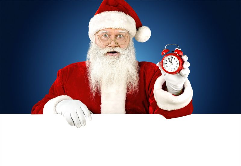 圣诞老人手里拿着闹钟