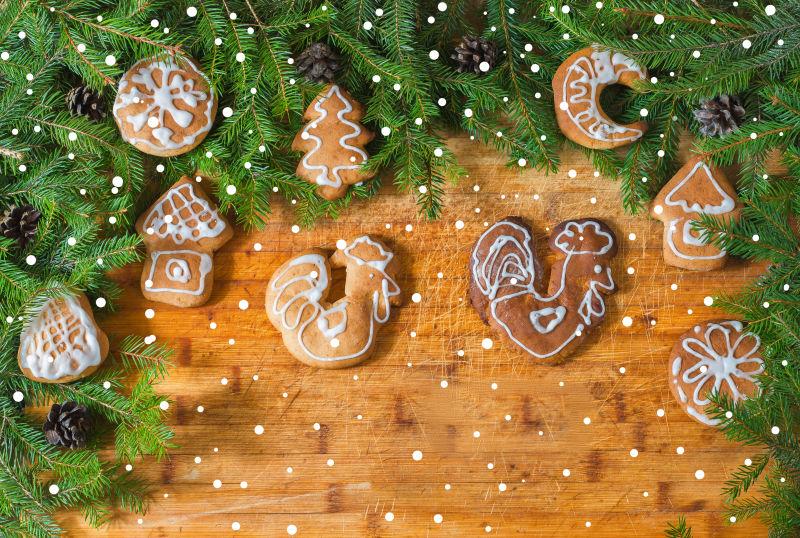 木桌上的树枝与圣诞节饼干