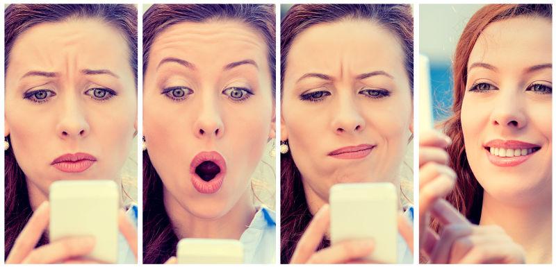 拿着手机表现不同表情的四个女人