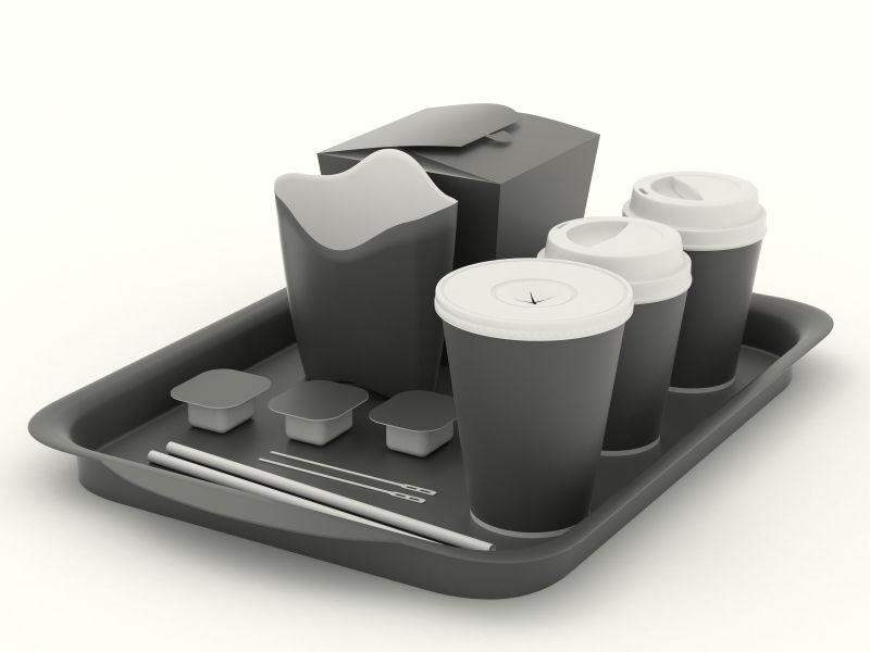 单色背景上放在托盘里的深灰色快餐餐具模型