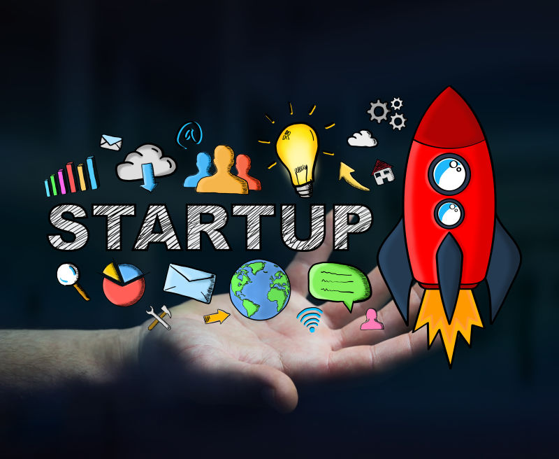 黑暗背景下的商人手持红色启动图