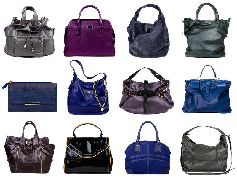 白色背景下的深色女式手提包