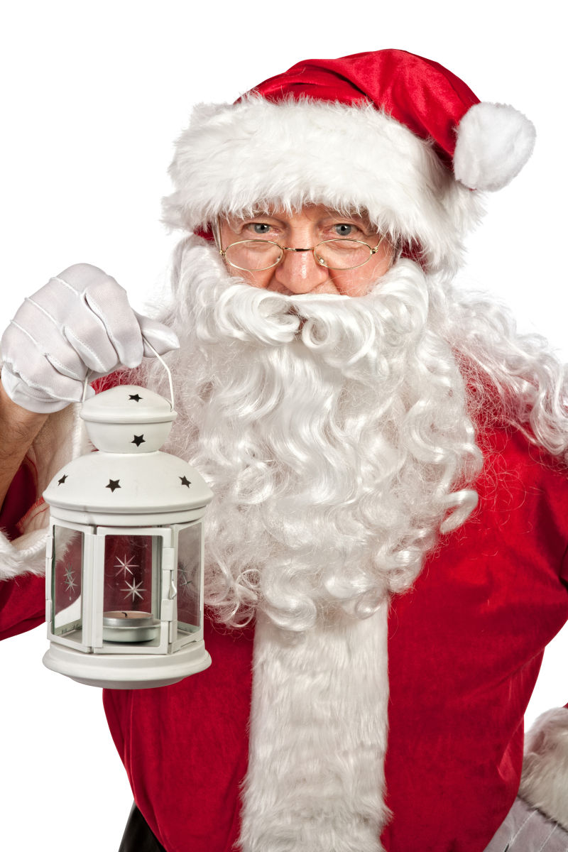 圣诞老人拿着一盏可爱的灯