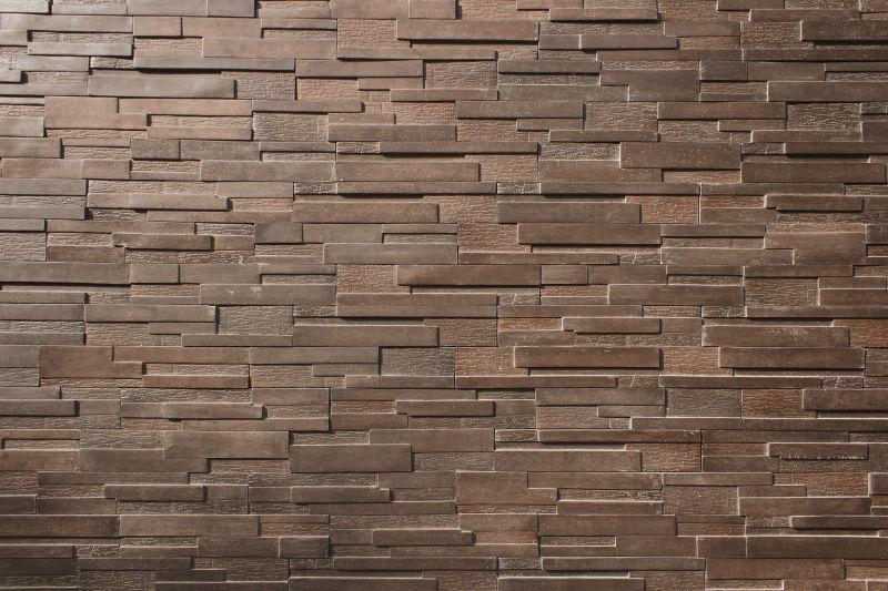 深褐色的石板墙纹理背景