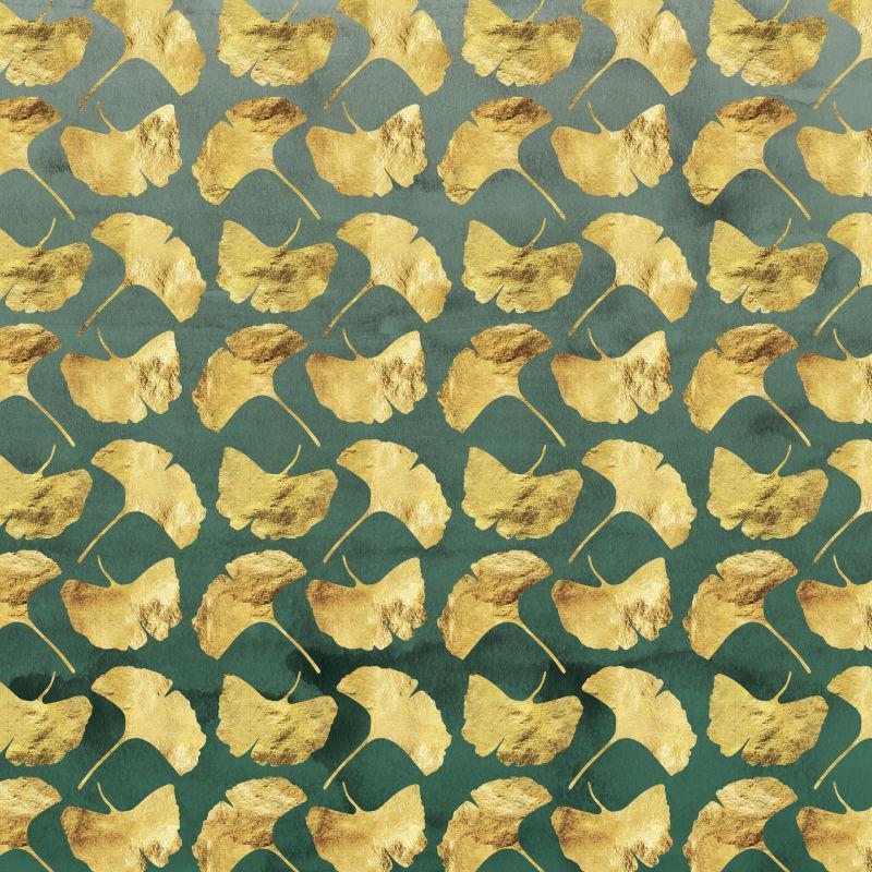 放在绿色背景上的金黄色的银杏树叶