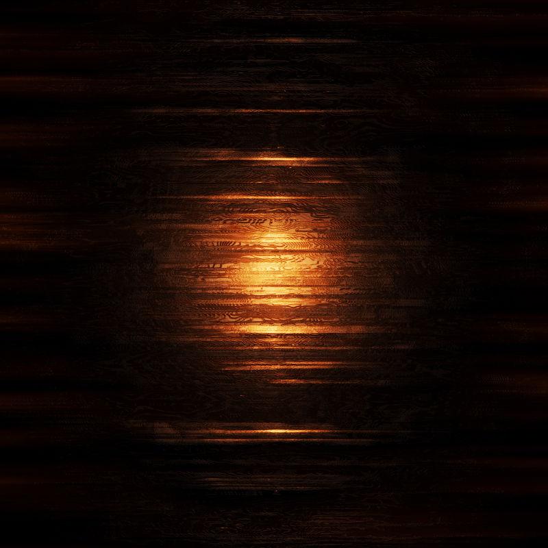 黑暗中橙色光下的纹理背景