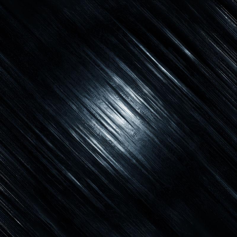 黑暗中橙色光下的纹理背景