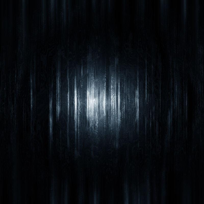 黑暗中灯光照射下的纹理背景