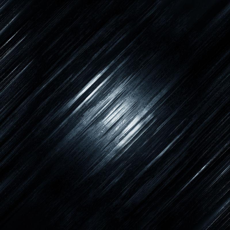 黑暗中光下的纹理背景