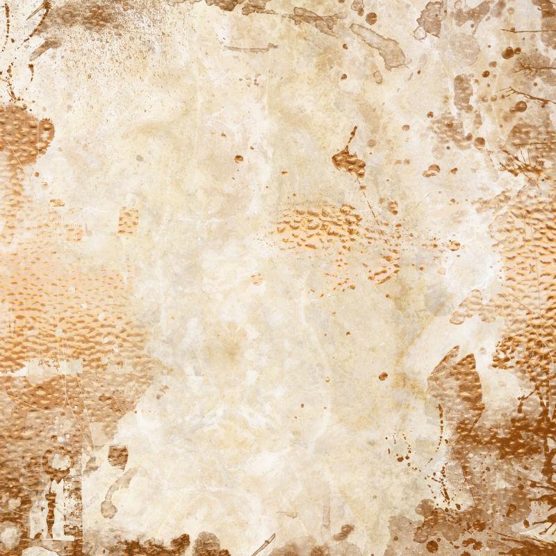 黄色大理石上的铜水溅射纹理