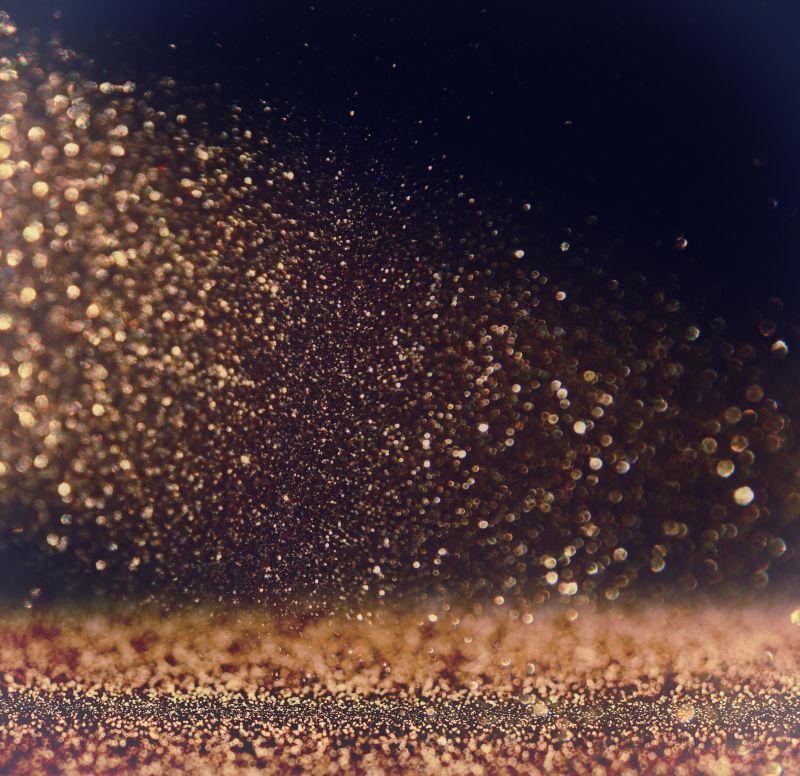 黑暗前的闪金属光亮片背景