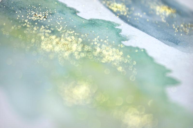 绿色模糊撒有金粉的水墨背景