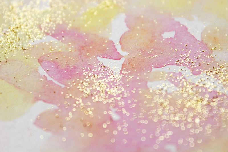 粉黄色撒有金粉的水墨背景