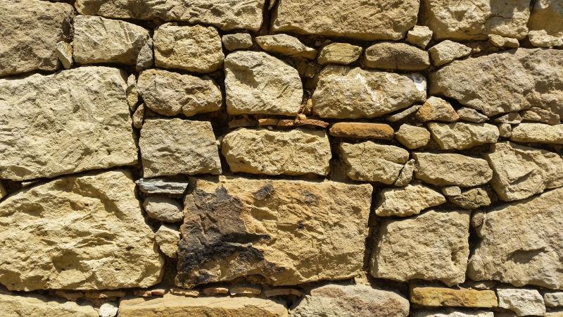 黄色的旧石墙背景