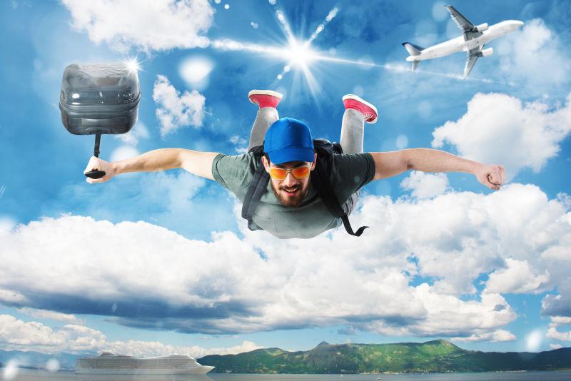 拿着行李箱从飞机上飞下来的男人旅游概念